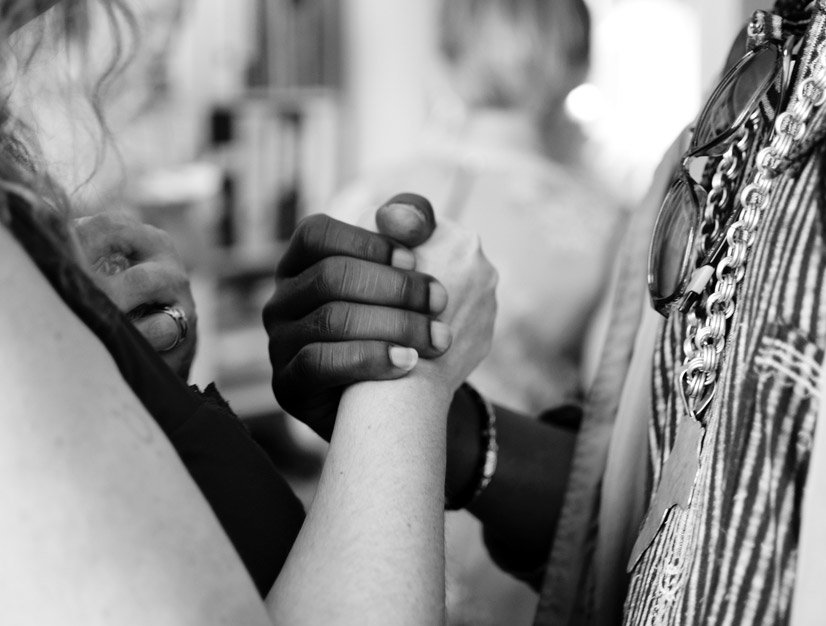 Two people holding each other hands